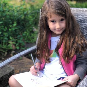 girl with nature journal