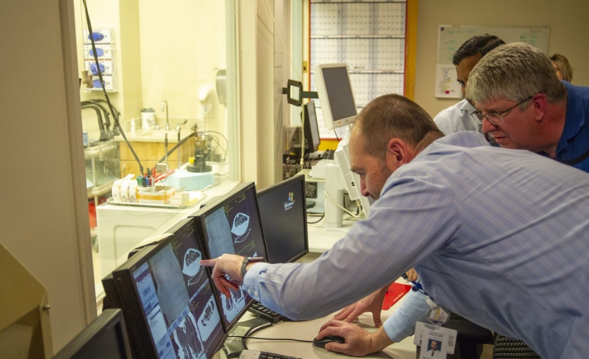 doctor reviewing CT machine screen