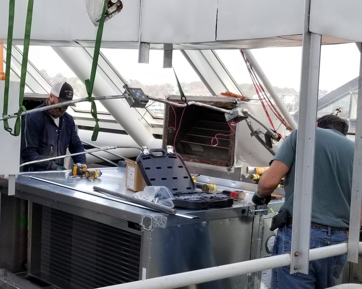 workers installing HVAC upgrade