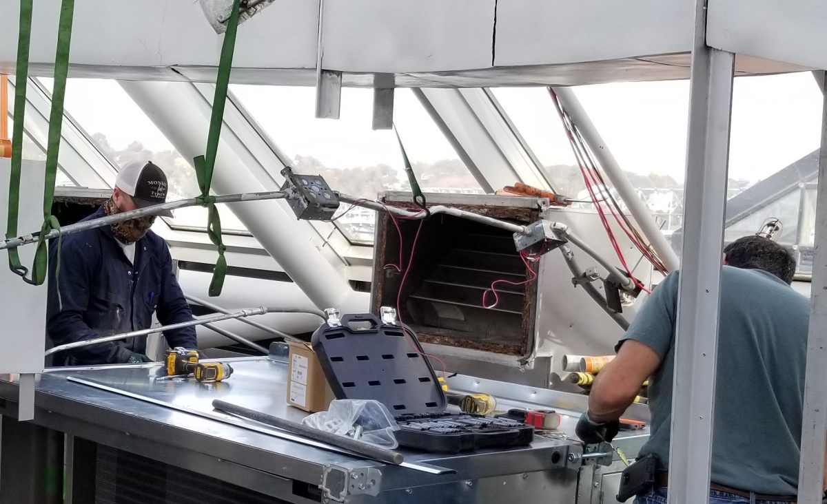 workers installing HVAC upgrade
