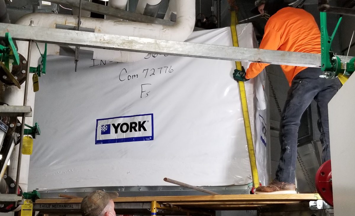 workers installing HVAC upgrade