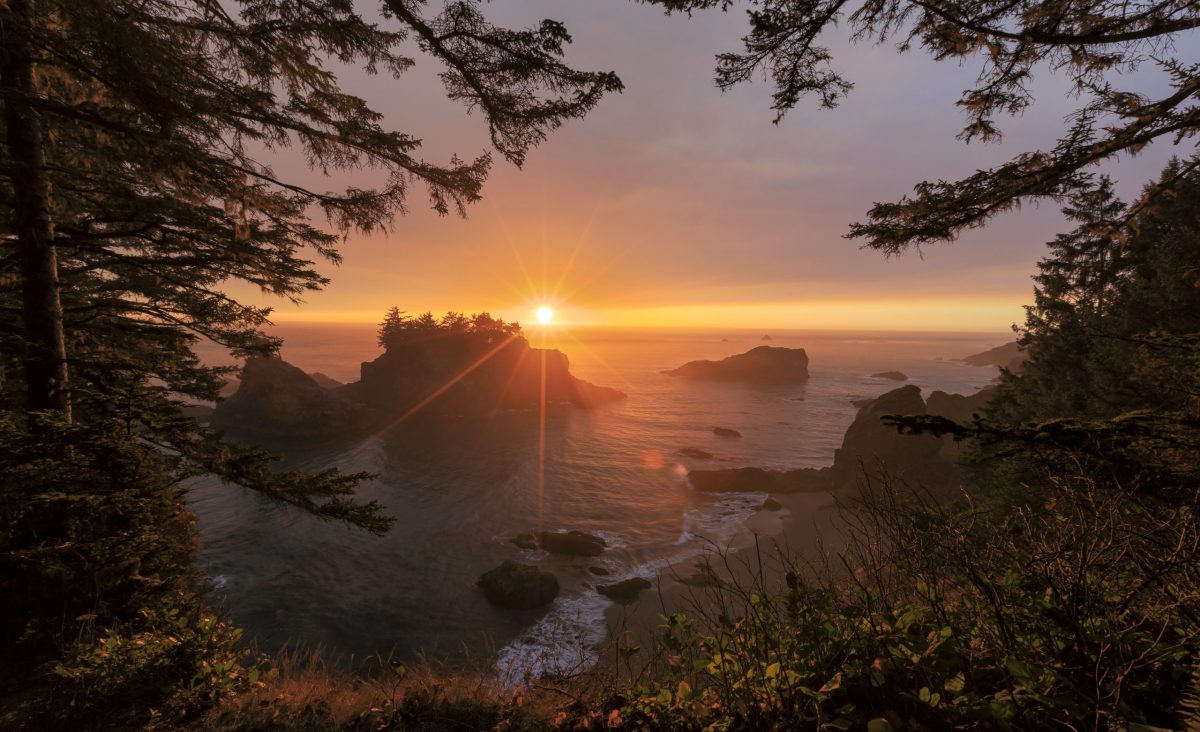 Sun sets over the stunning coastline of Secret Beach in the Samuel H. Boardman Scenic Corridor in southern Oregon.