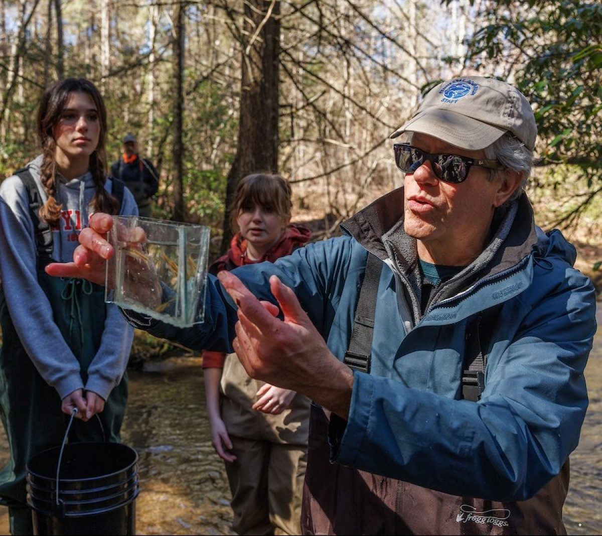 Aquatic Conservation Biologist Dr. Bernie Kuhajda showcases aquatic animals collected from Bumbee Creek to students from Baylor School assisting with collection efforts