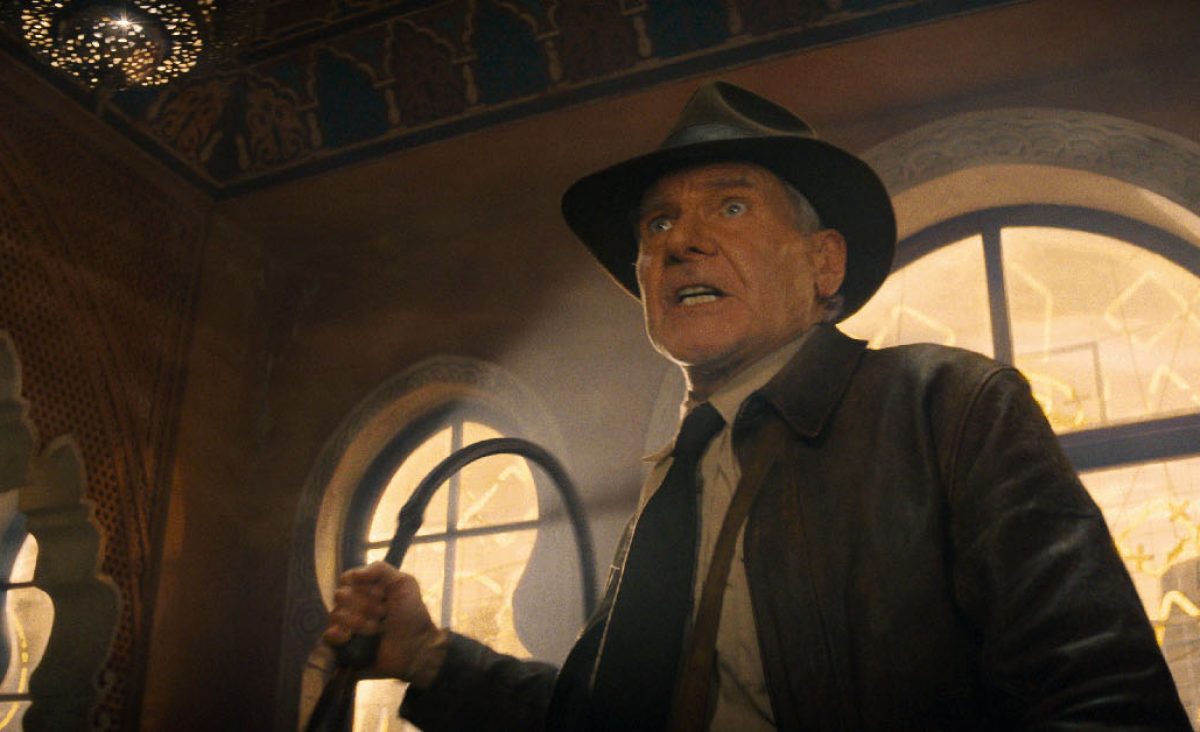 Indiana Jones holding a whip from Indiana Jones and the Dial of Destiny.