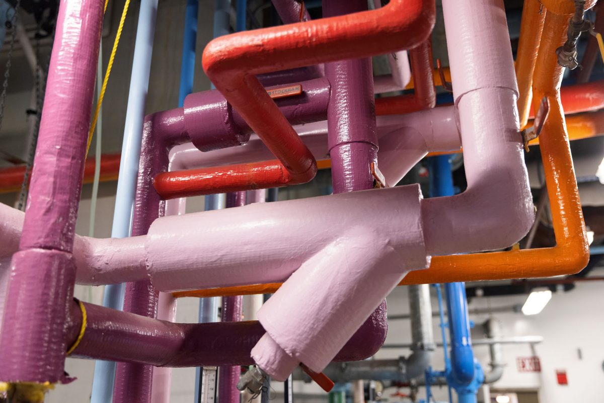 Multicolored pipes run through the Aquarium