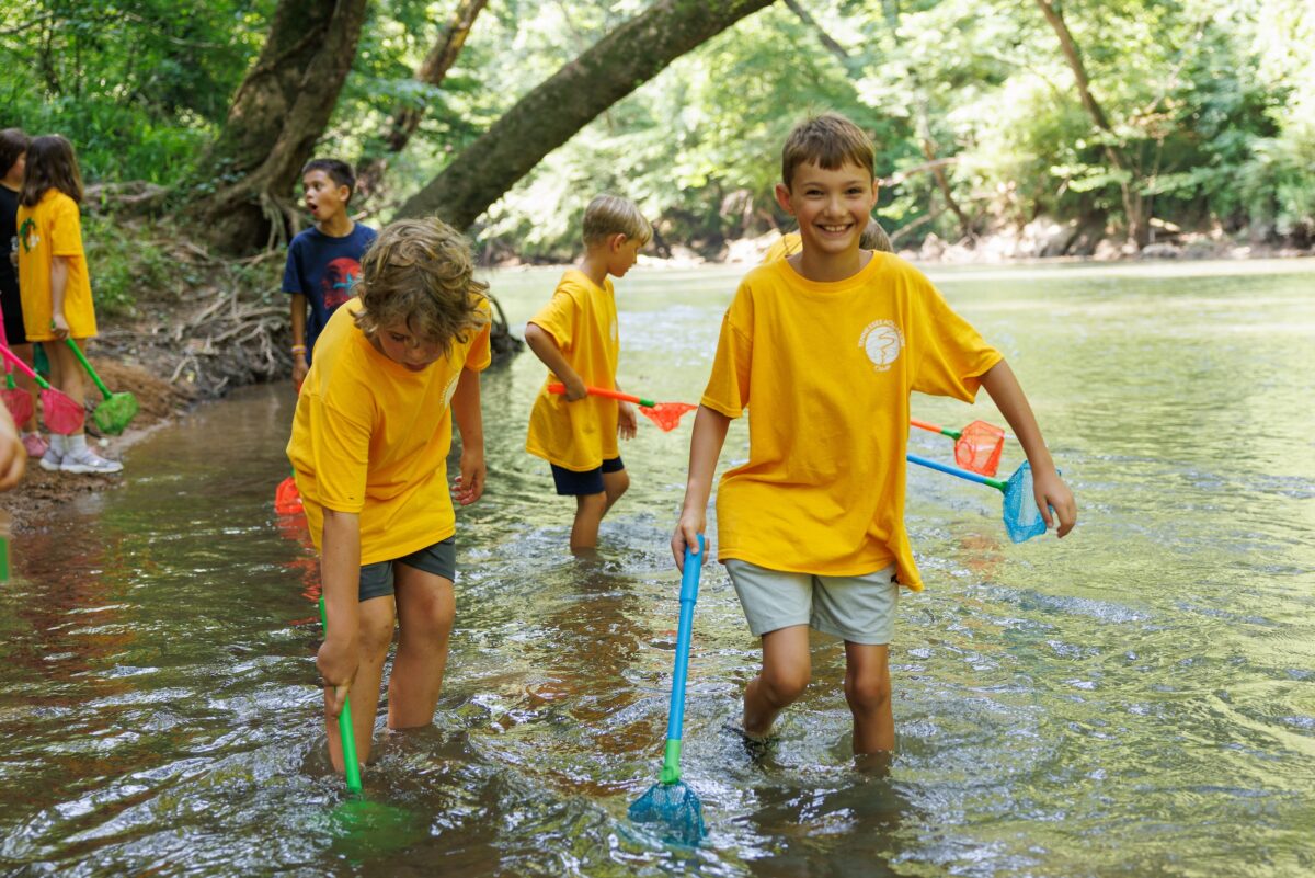 The River Guardians camp visits Audubon Acres to investigate a local stream for aquatic life.
