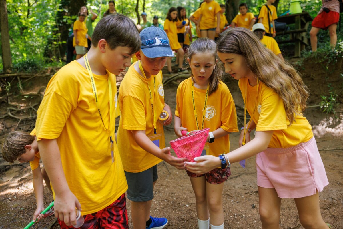 The River Guardians camp visits Audubon Acres to investigate a local stream for aquatic life.
