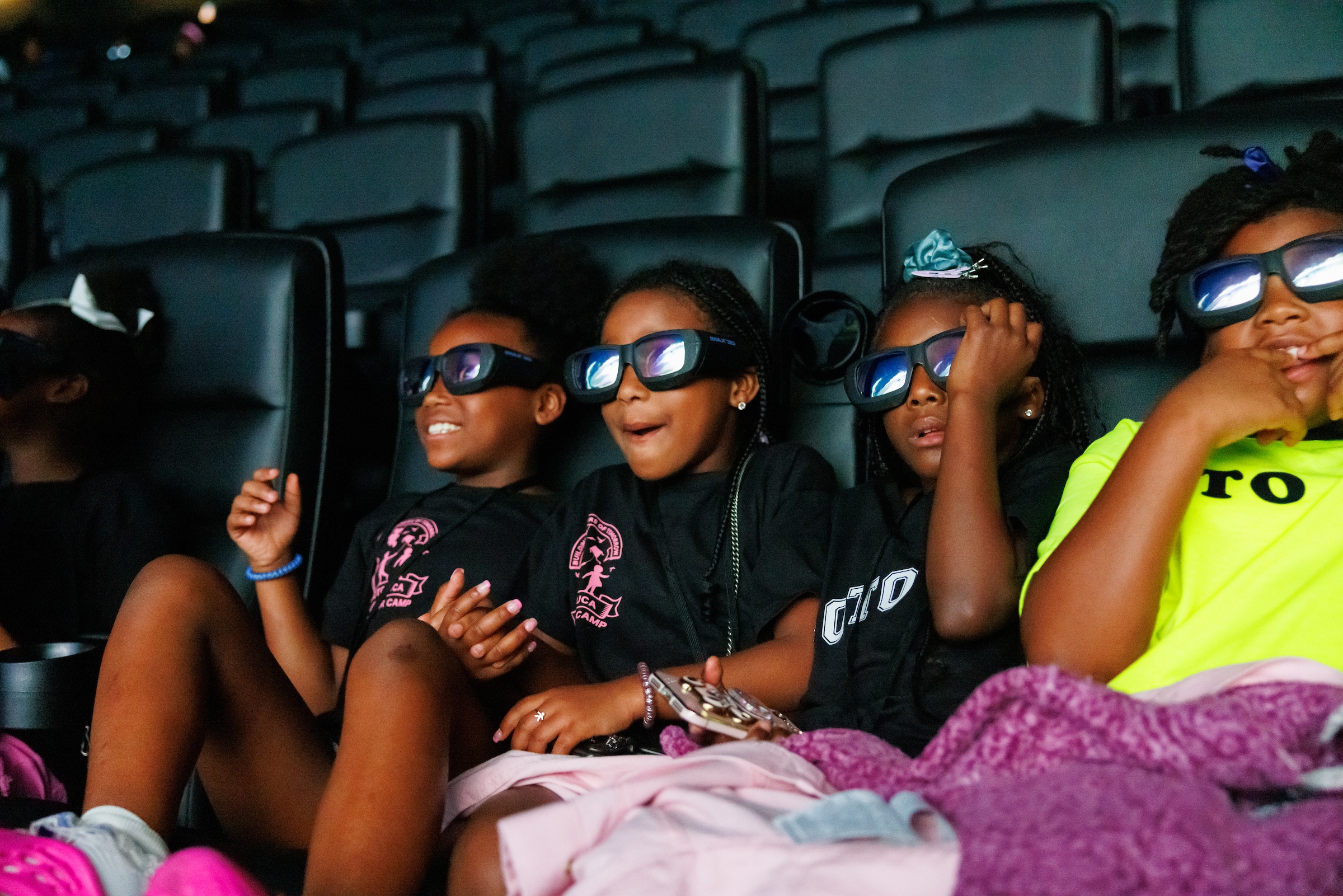 Viewers watching IMAX film with 3D glasses