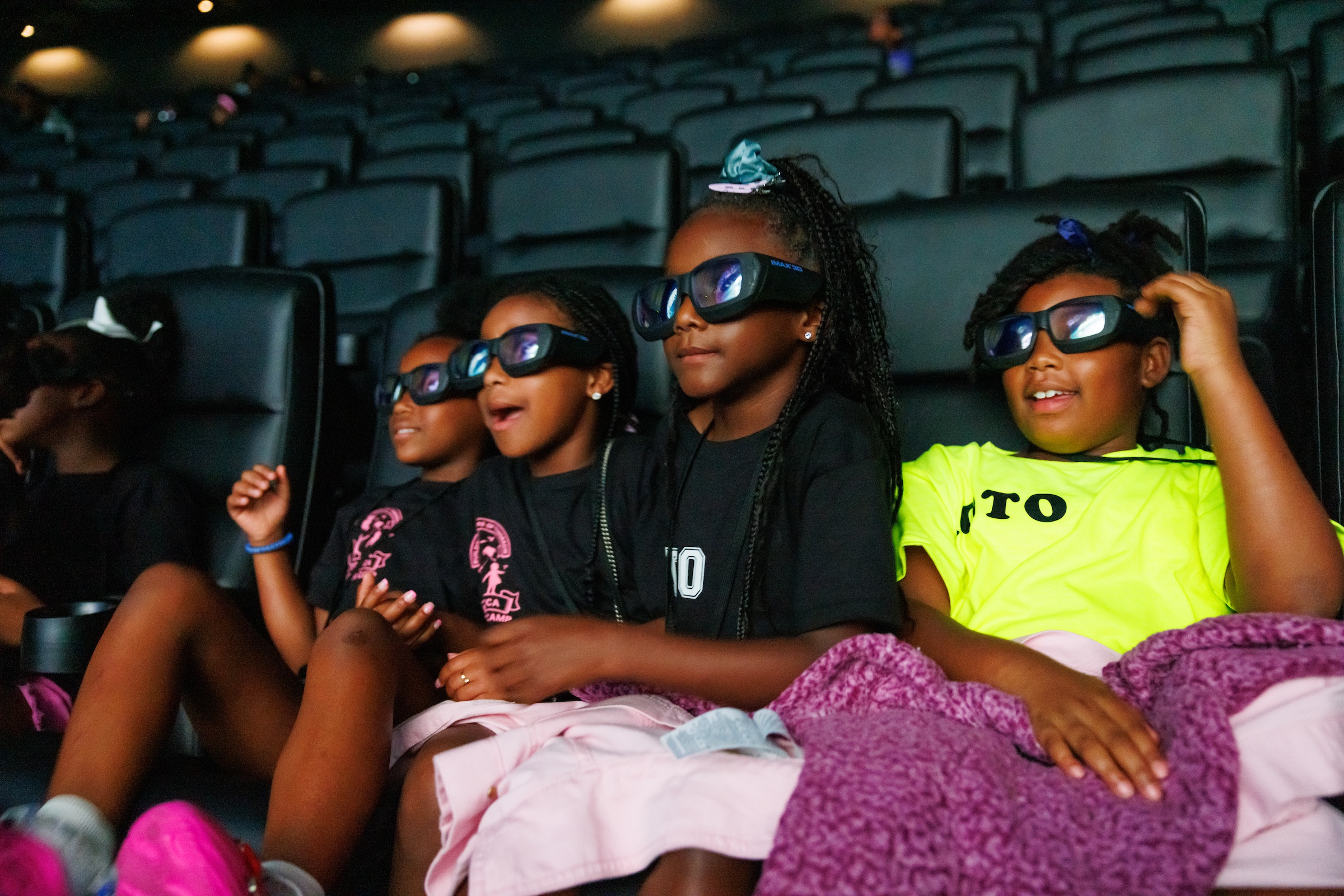 Viewers watching IMAX film with 3D glasses