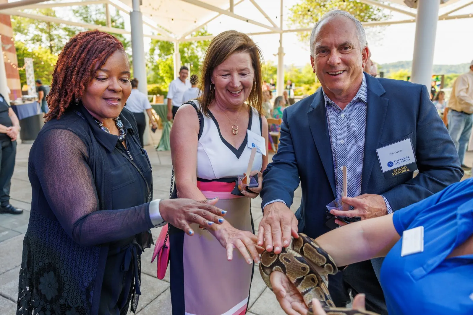 Guest touching a snake