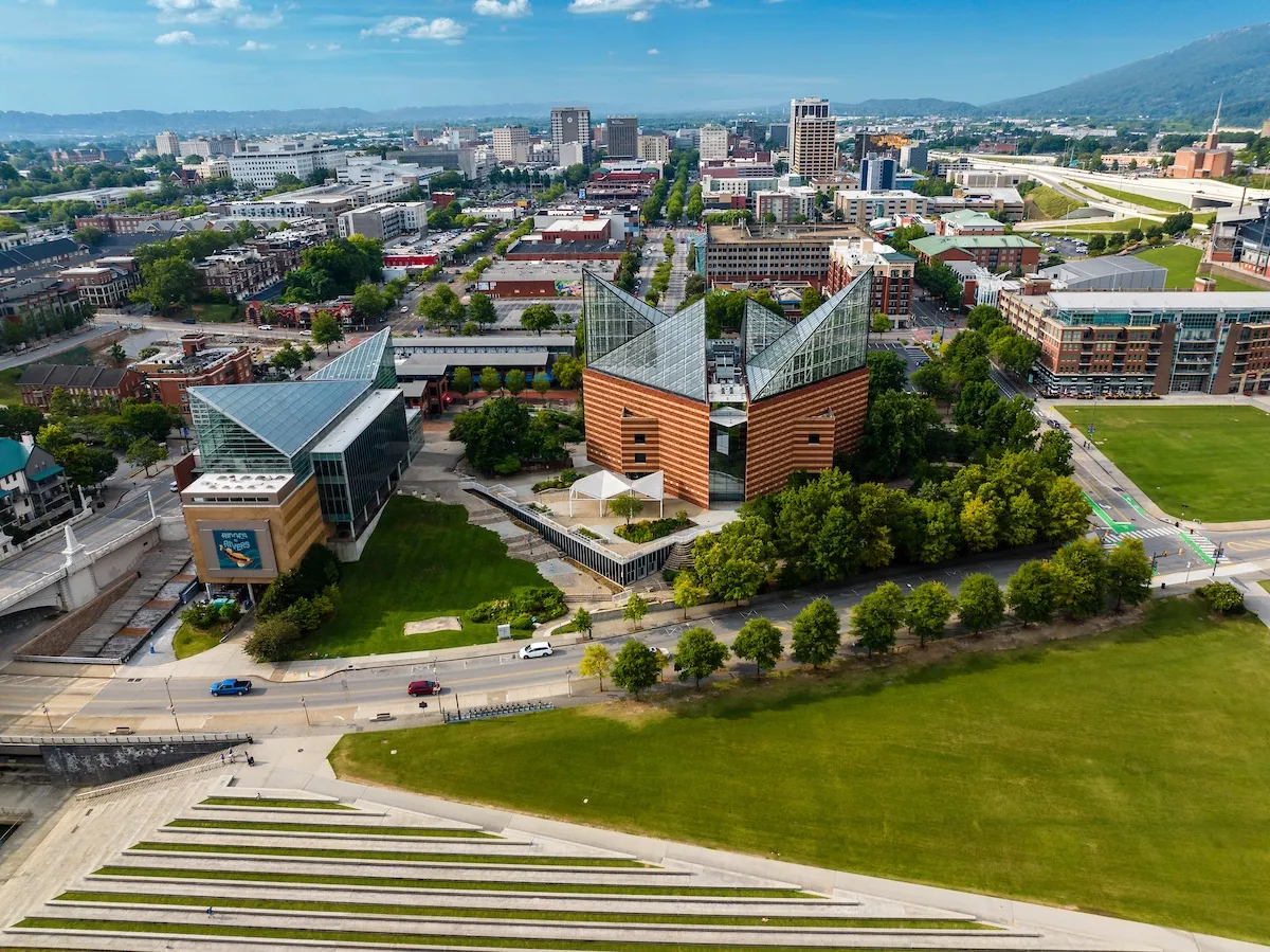 Aquarium exterior aerial view of both buildings with a view of downtown in the background