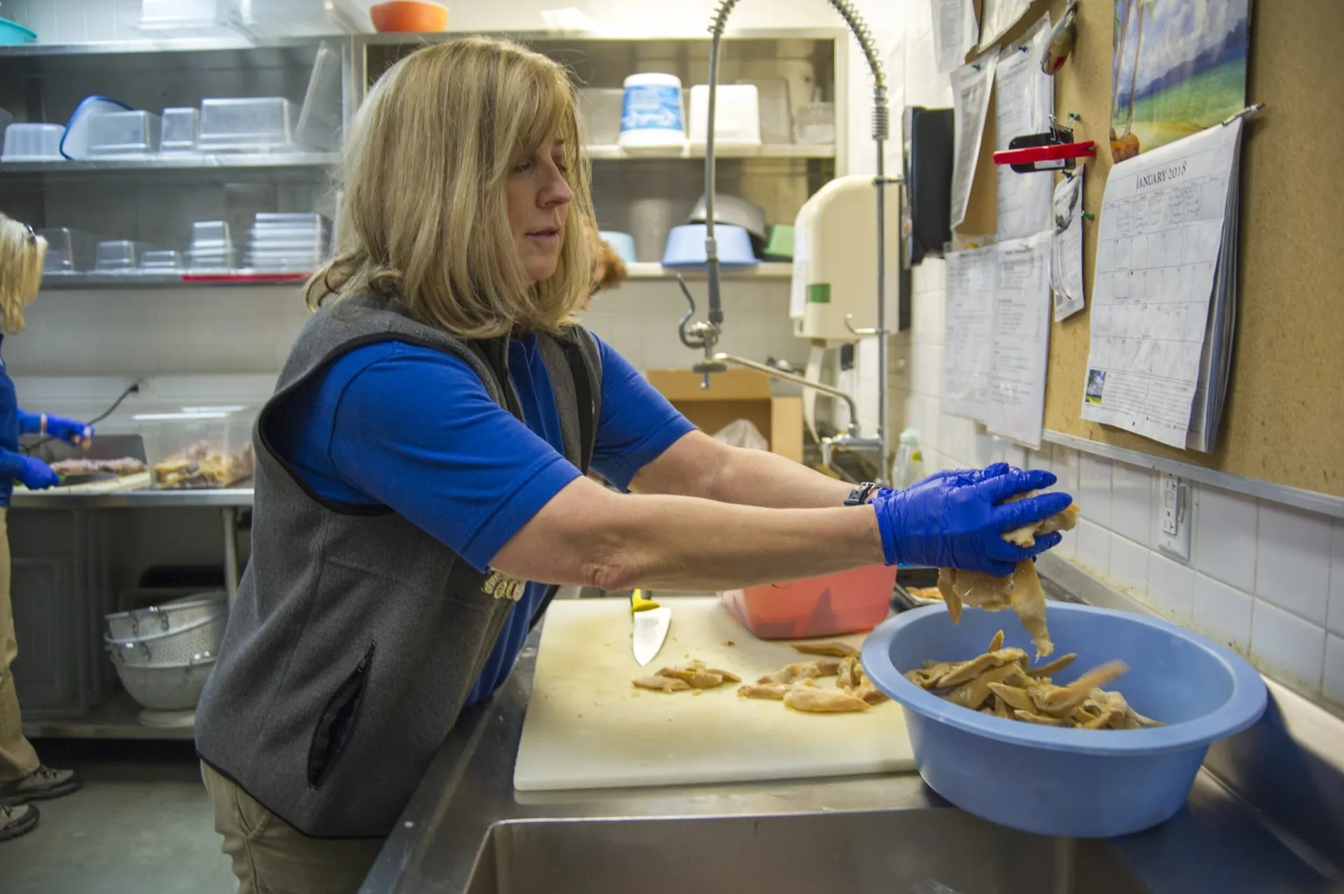 Volunteer preparing food