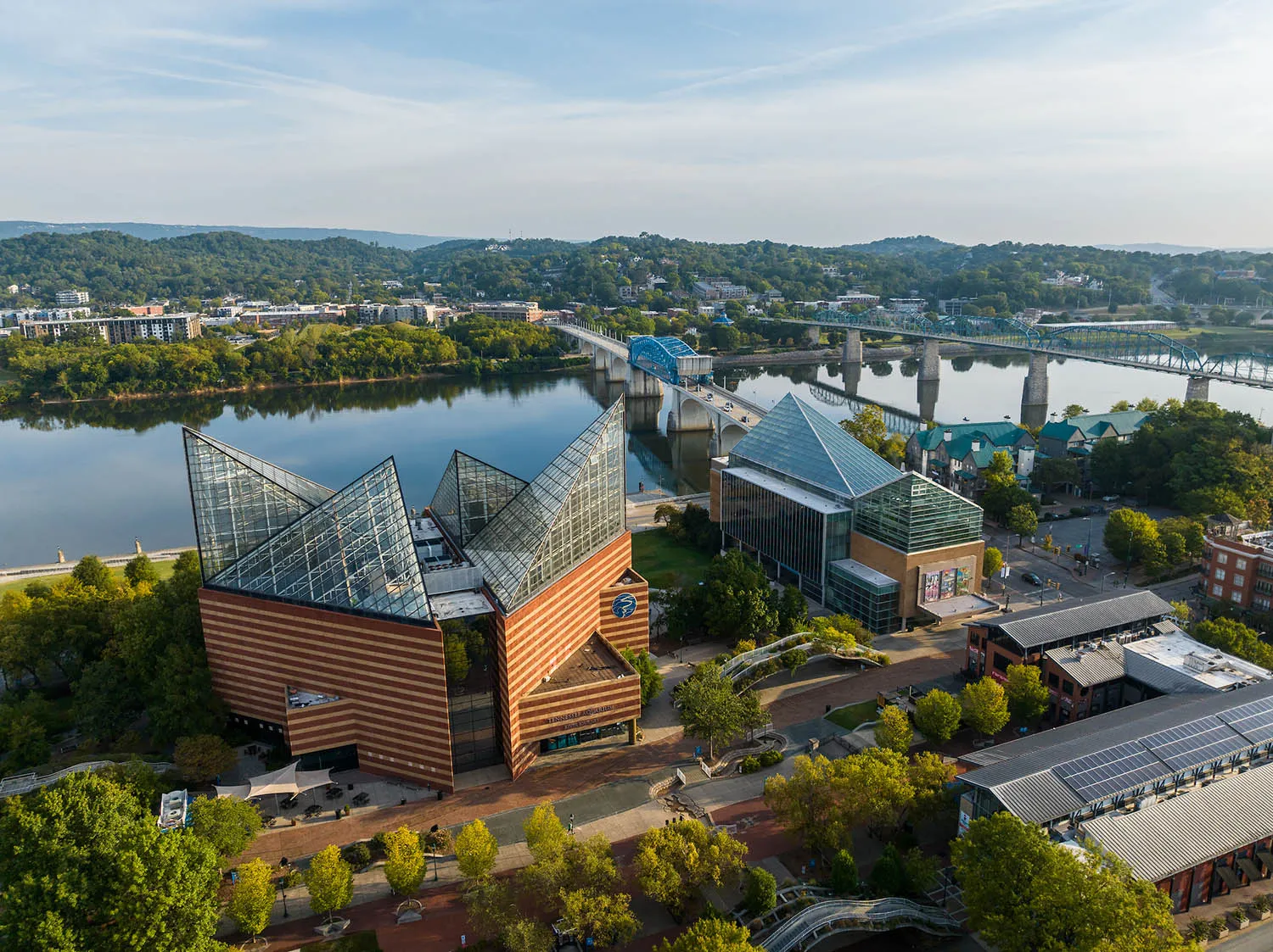 Aquarium exterior aerial view of both buildings with a view of the Tennessee River in the background