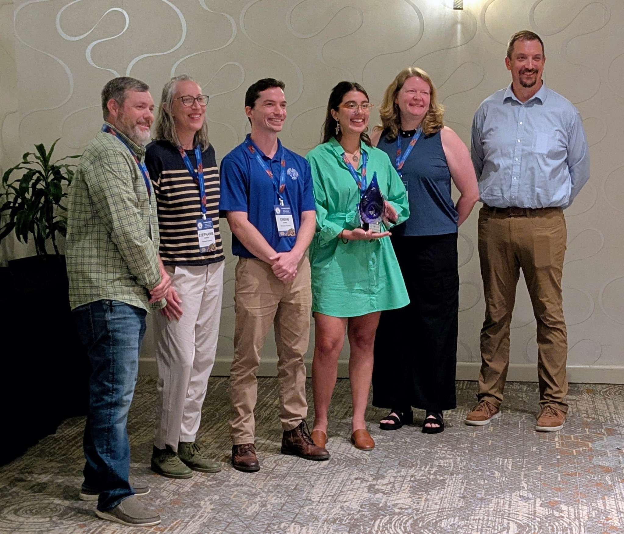 Representatives from the Tennessee Aquarium Conservation Institute pose with the River Champions award at the Tennessee River Basin Network’s annual conference in Asheville, North Carolina. Pictured are, from left, TVA Senior Water Resource Specialist Shannon O’Quinn, Tennessee Aquarium Conservation Manager Stephanie Chance, Natural Resource Specialist Drew Hardy, Watershed Coordinator Helaina Gomez, Vice President of Conservation Science and Education Dr. Anna George and TVA Senior Manager of Environmental Stewardship and Sustainability Paul Pearman. (Credit: TVA)