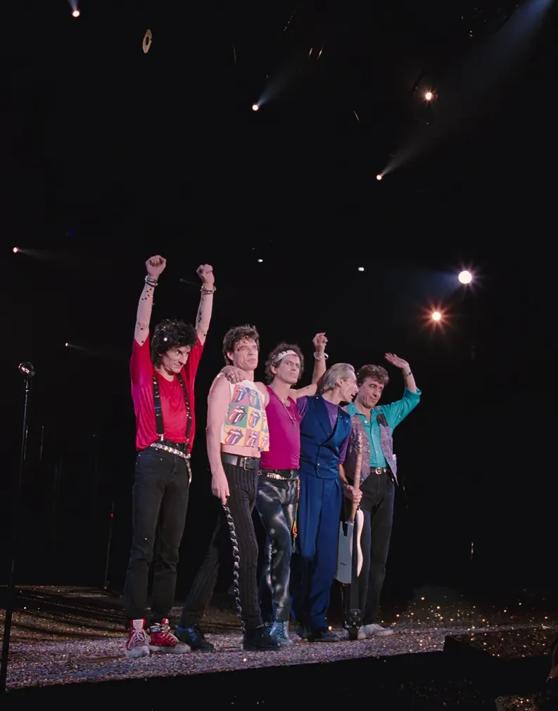 Rolling Stones members on a concert stage performing - movie still from Rolling Stone - At the Max coming to IMAX in December 2025