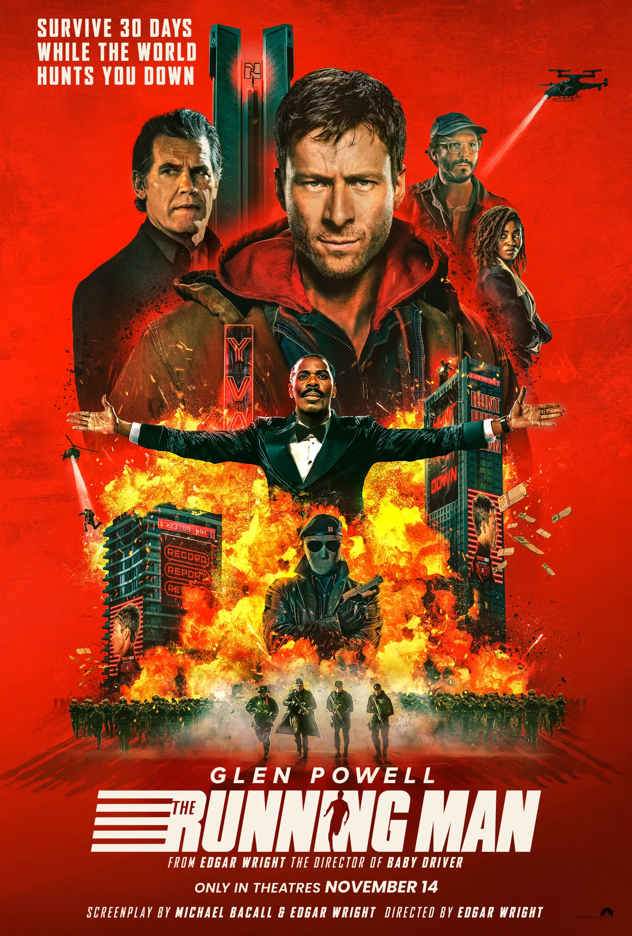 Poster with a red background and a collage of buildings on fire and characters for the Running Man movie, coming to theaters Nov. 2025 and starring Glen Powell.