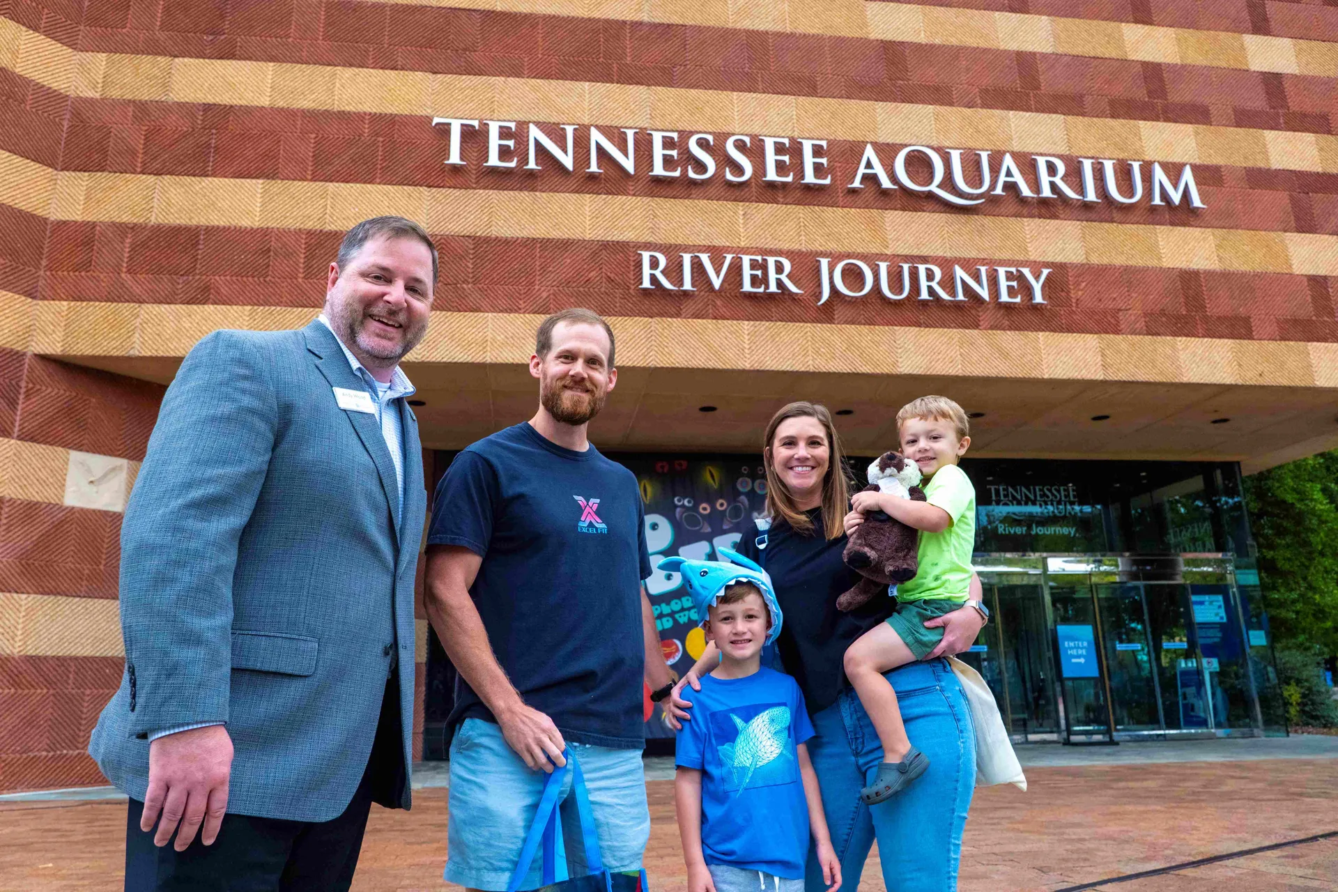 Tennessee Aquarium President & CEO Andy Wood, left, congratulates the Lee family — Vince, Connor, Olivia and Calvin, from left to right — on being the 29 millionth guests to visit the Aquarium since its opening on May 1, 1992. The Lees were visiting Chattanooga from Tupelo, Mississippi.
