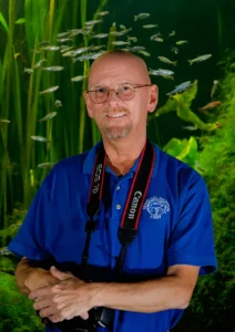 Todd Stailey poses with a camera