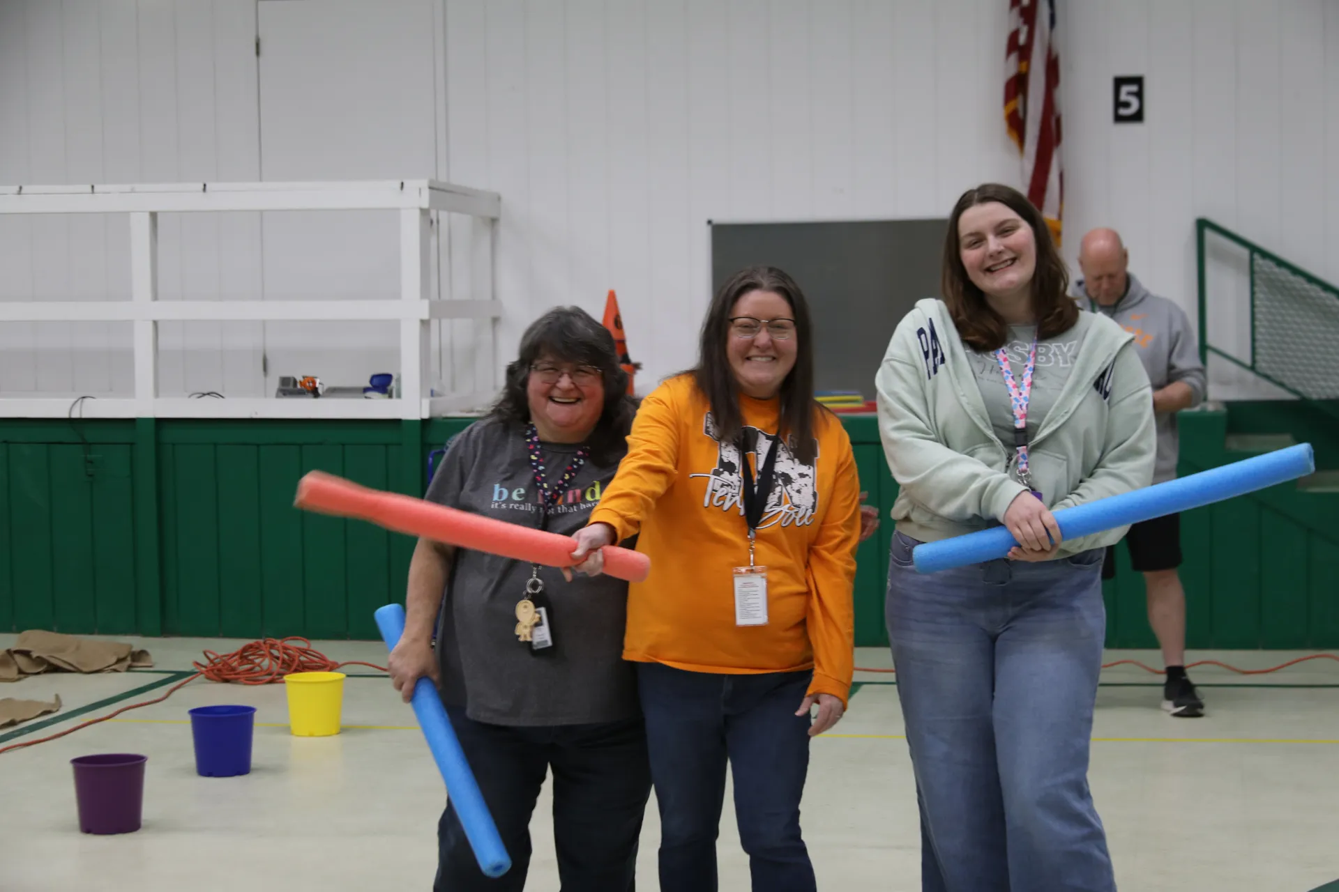 Teachers from Cecil B. Rigsby Elementary School warm up before the pep rally.