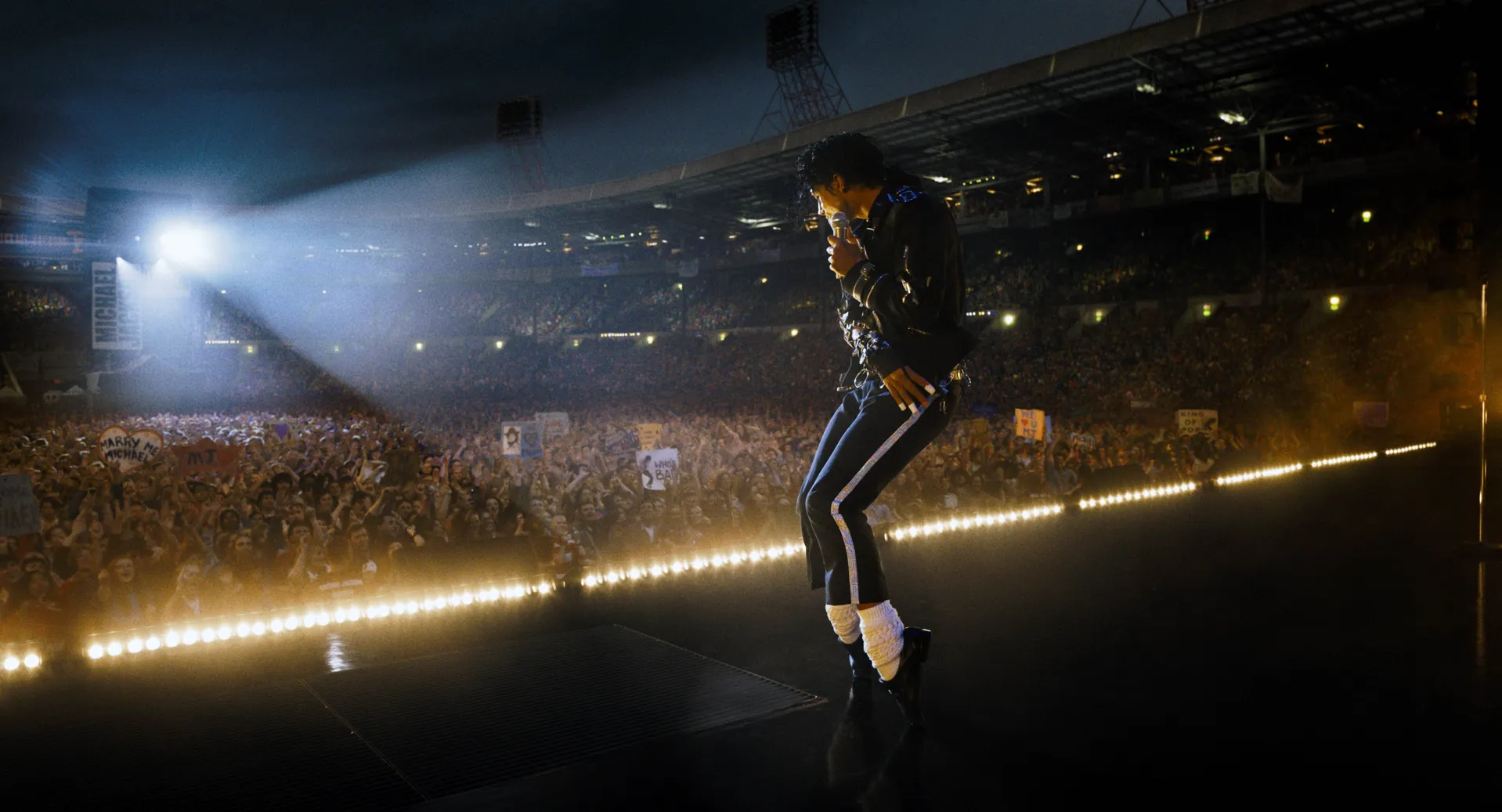 An image from the Michael biopic of Michael on stage, performing for a crowd.