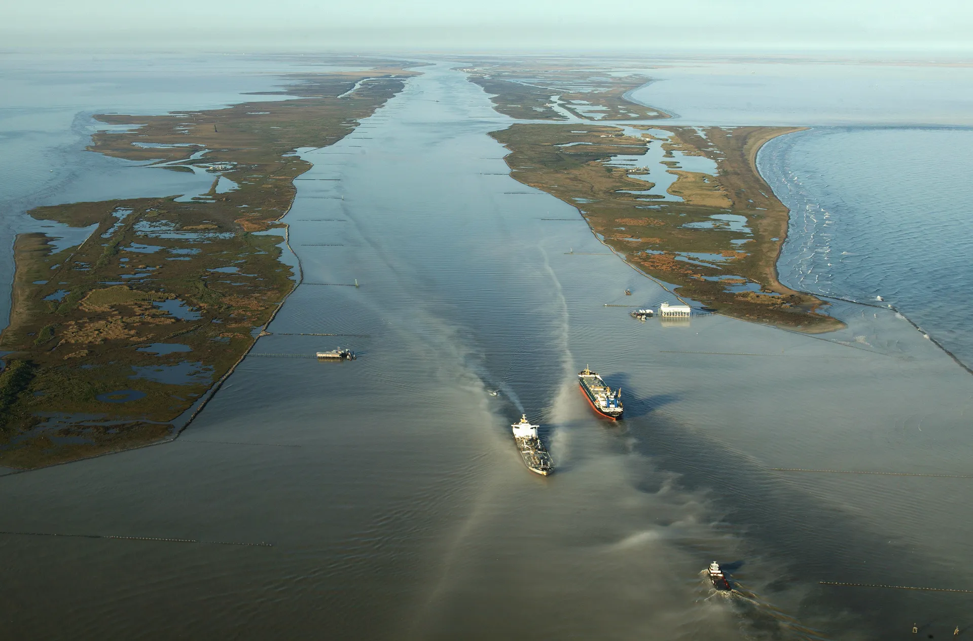 Boats push up and down the Mississippi River at the waterway's mouth in the Gulf of Mexico.