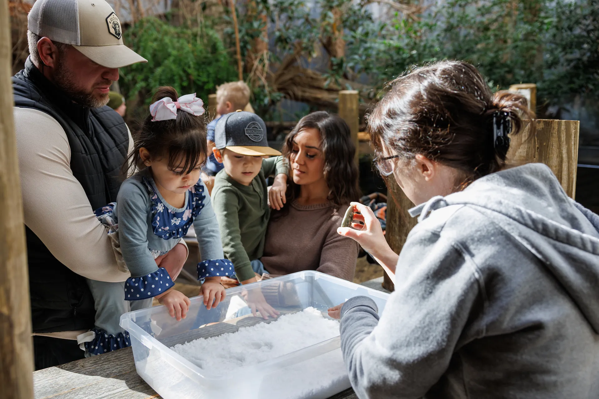 a group of guests at the Tennessee Aquarium interacting with an educator