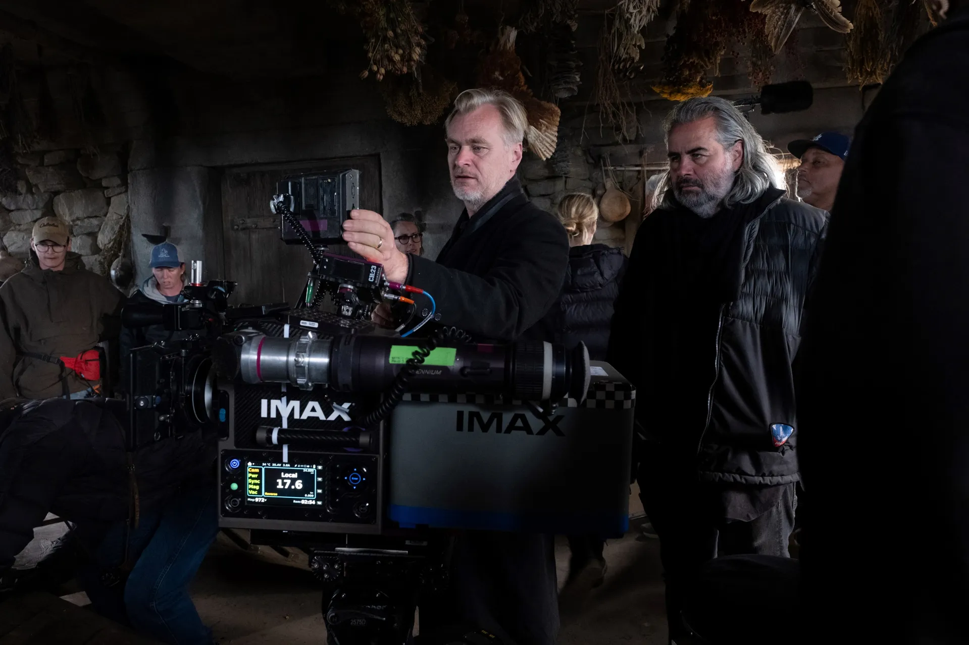 Director Christopher Nolan checks the framing of an IMAX camera on the set of The Odyssey. Nolan's latest epic is the first feature-length film to be recorded entirely on IMAX 70mm film. (Credit: IMAX)