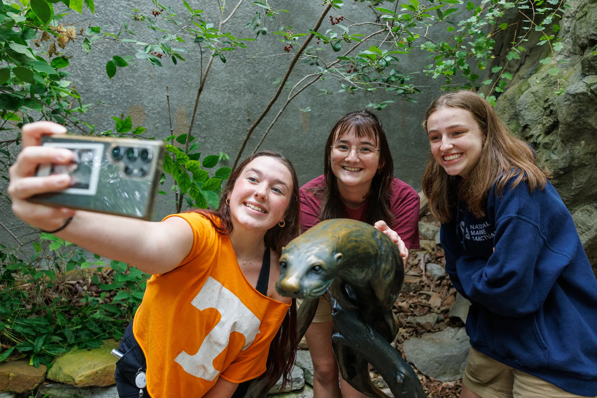 College students enjoying the Appalachian Cove Forest exhibit at the Tennessee Aquarium