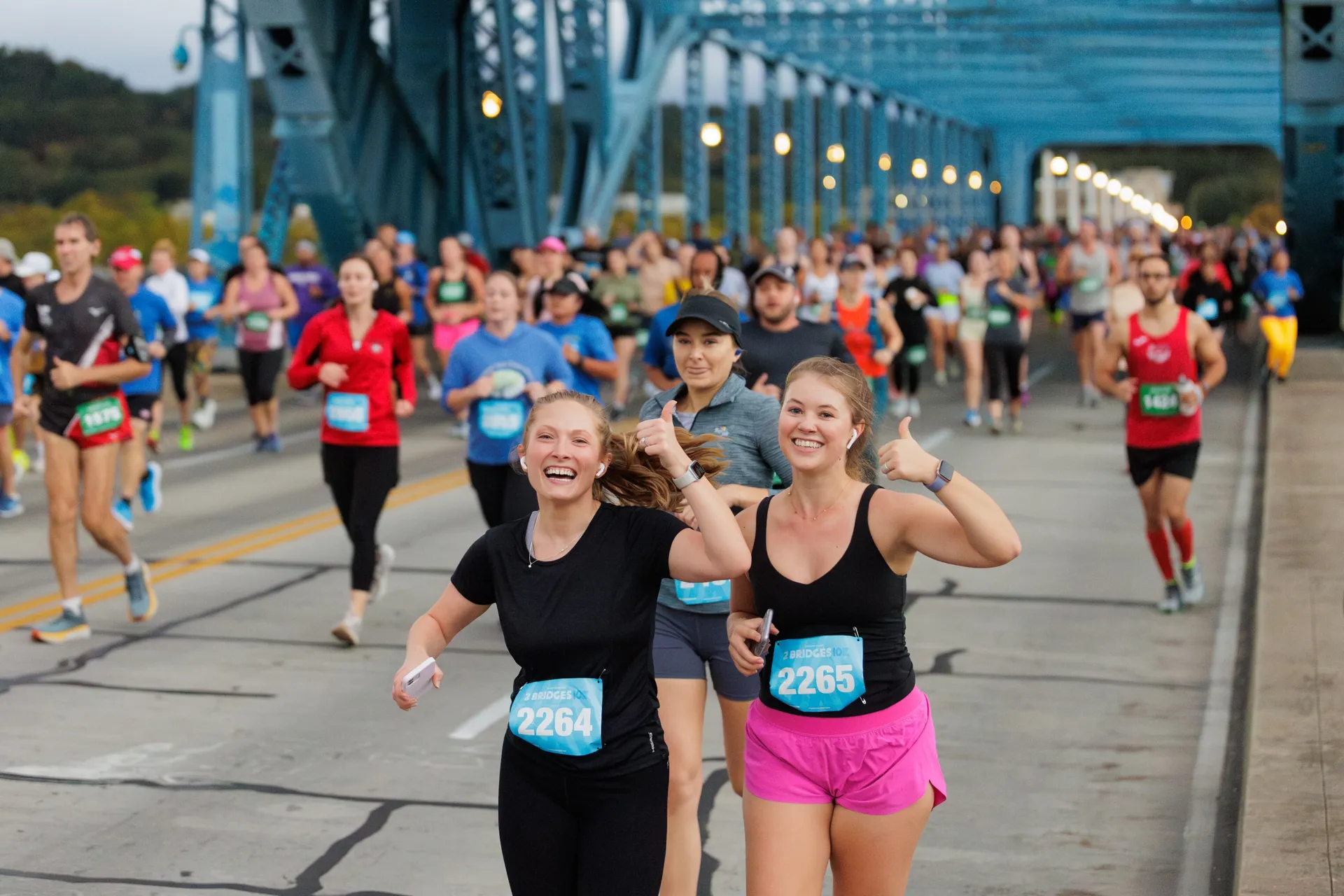 Race participants running across Chattanooga's Market Street bridge